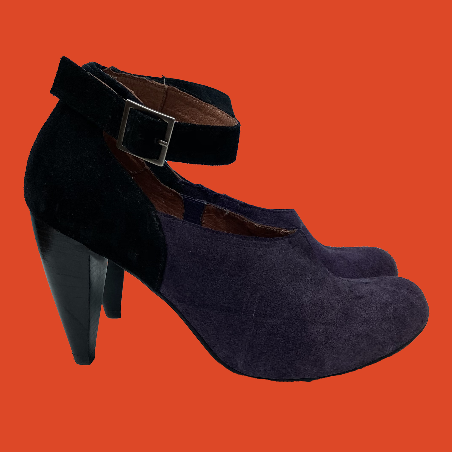 Black and purple suede shoes.
