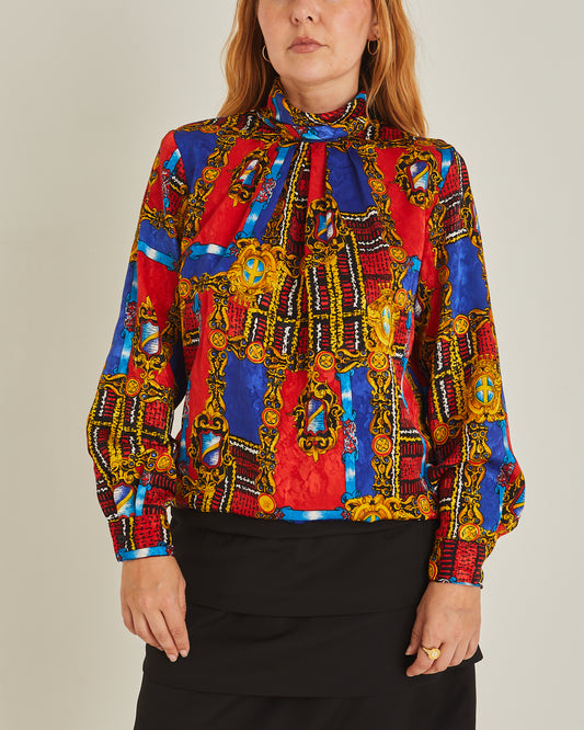 80s Bold Red, Gold, and Blue Print Long Sleeve Shirt: A vibrant long-sleeve shirt with a high neck, featuring a bold '80s-inspired print in red, gold, and blue geometric patterns