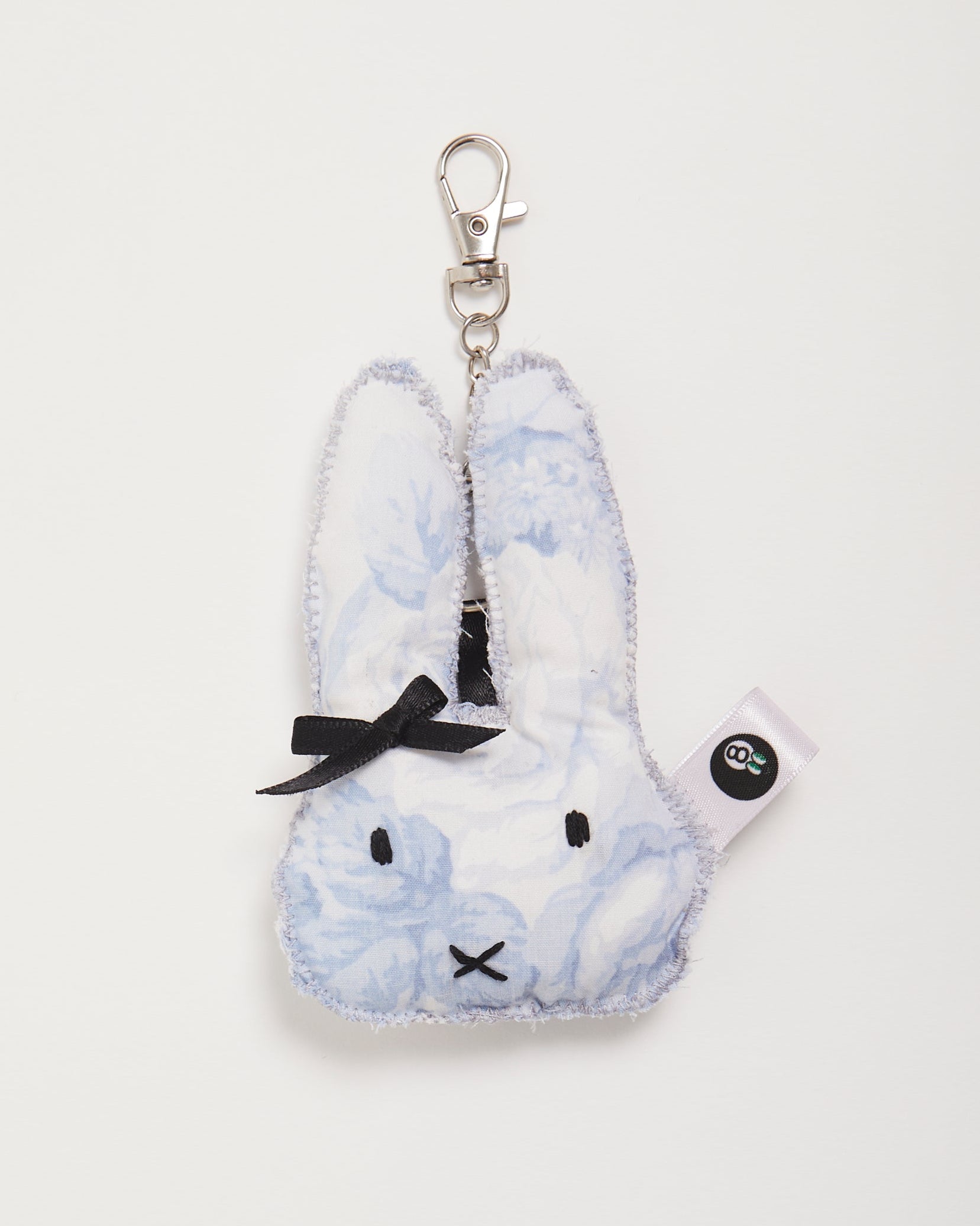 Plush rabbit-shaped keychain with watercolor floral in blue design on a white background
